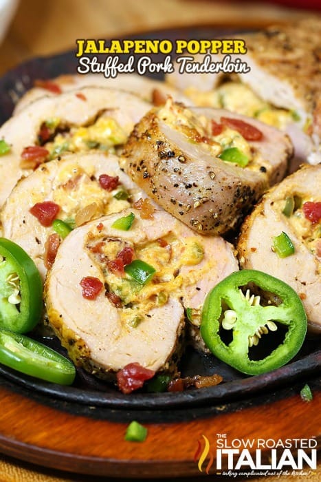 Perfectly seasoned cream cheese, Colby Jack cheese, bacon crumbles and jalapenos create the perfect filling for this Jalapeno Popper Stuffed Pork Tenderloin. A really simple recipe, it comes together in a snap. The end result is a tender, juicy pork tenderloin that is bursting with flavor and will surely knock your socks off!