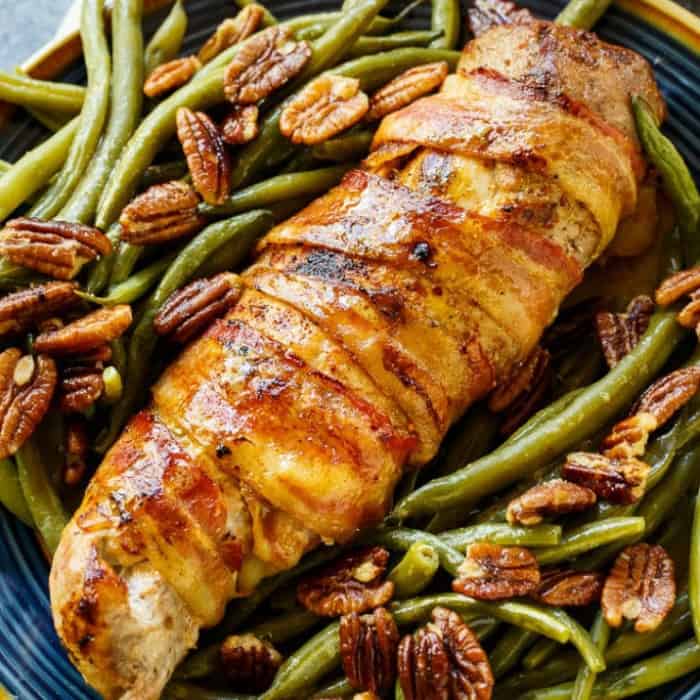 This Bacon Wrapped Pork Tenderloin is juicy and smokey and makes an exceptional family meal for the holidays. I love to serve it with a side of Green Beans with Pecan Vinaigrette.