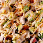 A close up of a pasta dish with broccoli and cheese