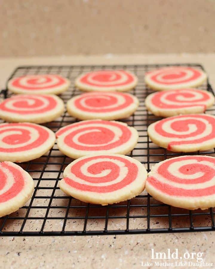 Valentine's Pinwheel Cookies are a simple sugar cookie dough made into two colors so you can swirl them together into a fun pink and white cookie!