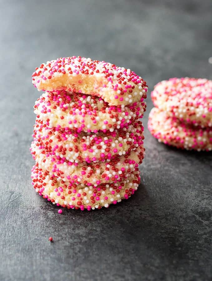 These soft batch sugar cookies are super easy to whip up!  Soft, sweet, chewy, cookies rolled in your favorite sprinkles – these are perfect for Valentine’s day, or any day of the year!