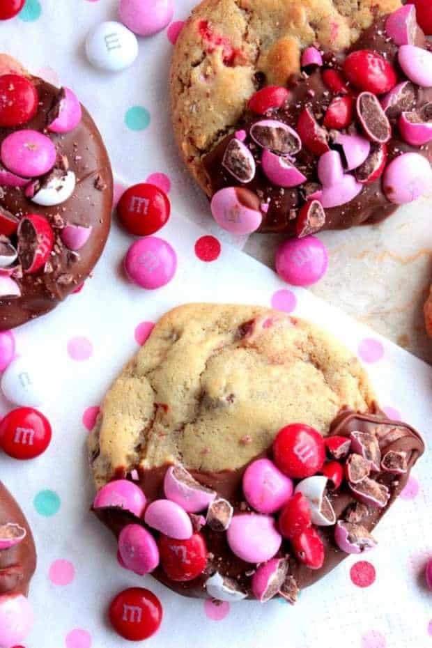 If you love soft chewy chocolate chip cookies this is the recipe for you! These Chocolate Dipped Chocolate Chip M&M Cookies are amazing! They would be perfect for you Valentine or anyone that loves cookies!