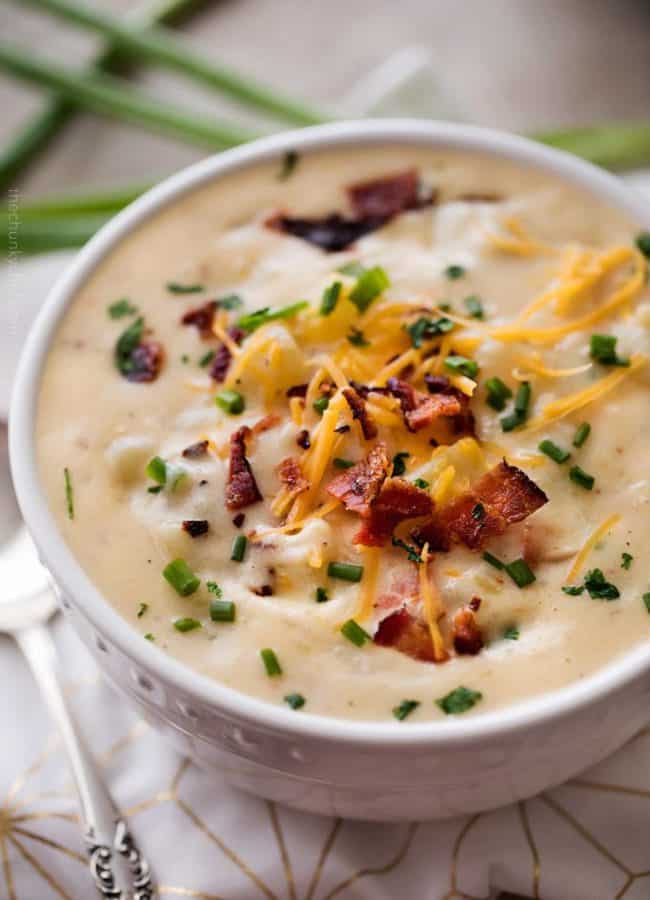 Skinny Crockpot Loaded Potato Soup is made entirely in the slow cooker and tastes just like a loaded baked potato, yet is lightened up so you can have a guilt-free bowl!