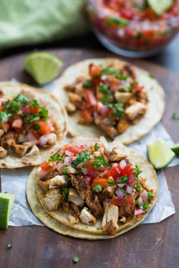 My family goes crazy for these grilled chicken street tacos, and I love how EASY they are to make! Marinated chicken thighs are grilled to perfection and served with warmed corn tortillas, pico de gallo, and cilantro.