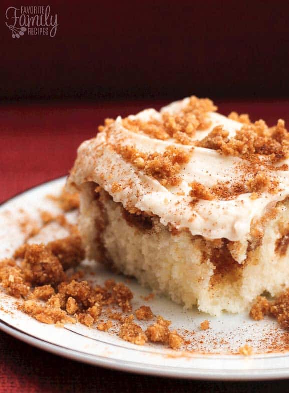 Cinnamon Swirl Cake is like a cinnamon roll in cake form. A cinnamon crumble is swirled through a white cake with cream cheese frosting on top.