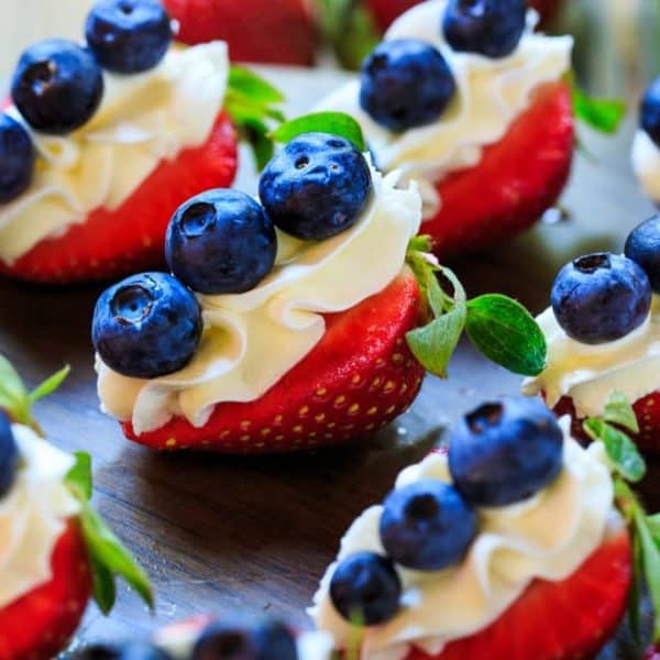 Red, White, and Blue Cheesecake Strawberries are perfect for the 4th of July or any summer potluck or picnic. They make a healthier dessert option and look so festive. Plus they are simple to make.
