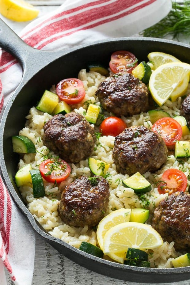 This Recipe for One Pot Greek Meatballs with Lemon Dill Rice includes a savory Greek spiced beef meatballs. creamy arborio rice and vegetables, all cooked together in a single pot!