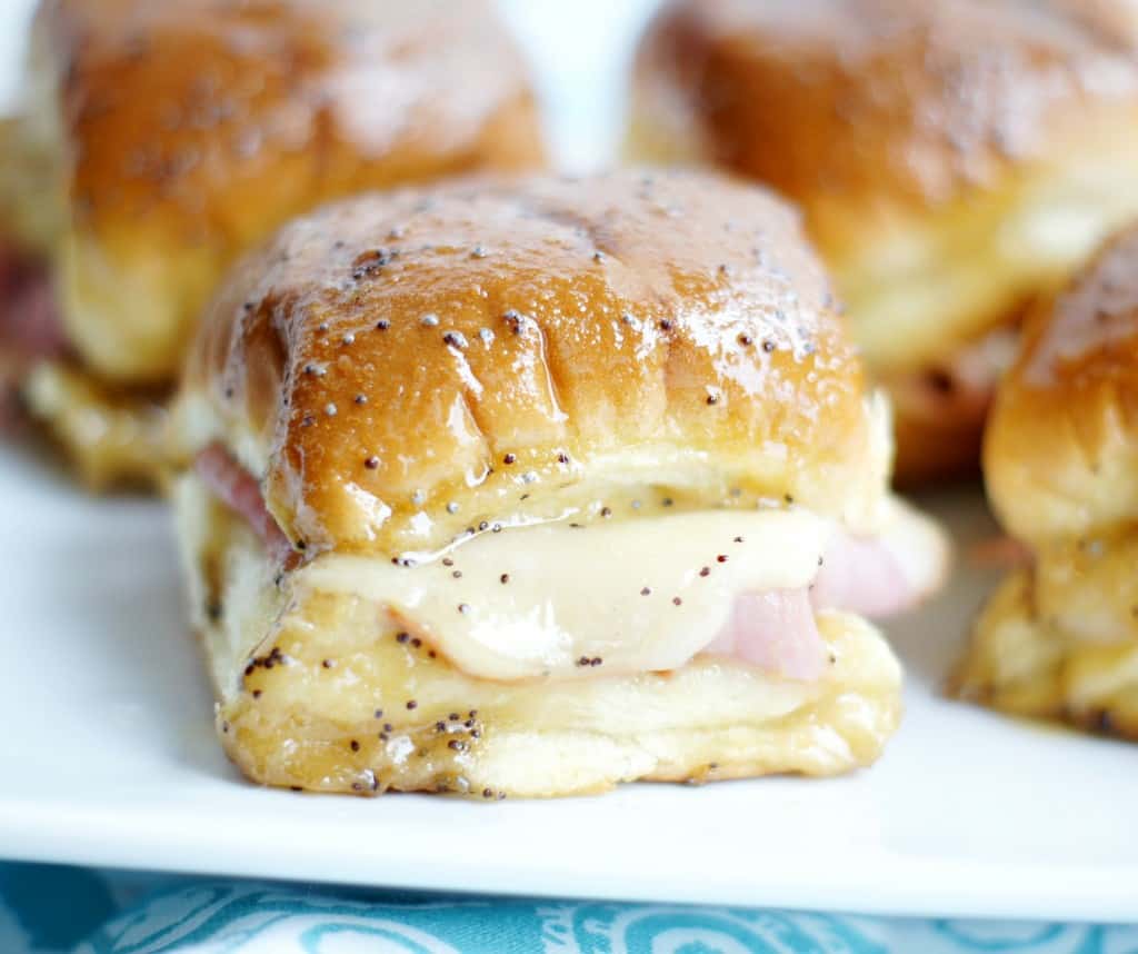 These caramelized ham & swiss sliders seem to have been a regular in our dinner rotation the last few months. We can’t seem to get enough of them. They are seriously the bomb! They are one of those things you could eat yourself sick with because they are so good it’s hard to stop at just one. You’ll be licking your fingers and find yourself going back for a second and then a third. They are dangerous I tell you!