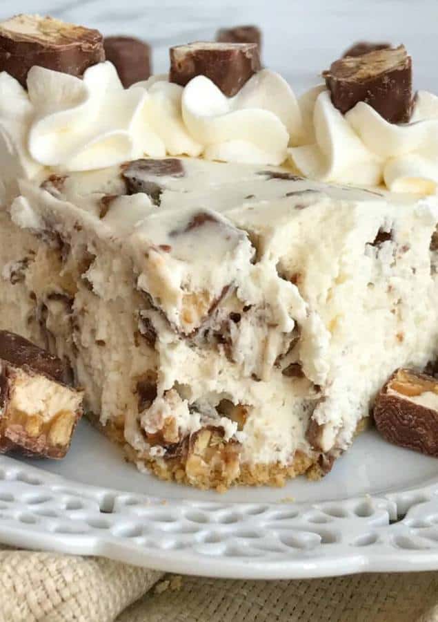 No bake Snickers cheesecake cream pie is so creamy, sweet, and loaded with Snickers candy. An easy, no bake cream pie that comes together in just minutes. Serve with whipped cream, chocolate drizzle, and more Snickers chunks