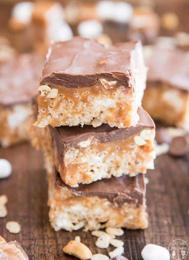 Snickers Rice Krispie Treats are traditional marshmallow rice krispie treats made even better. Topped with salty peanuts, gooey caramel and a rich layer of chocolate. They're perfectly sweet, salty and so delicious!