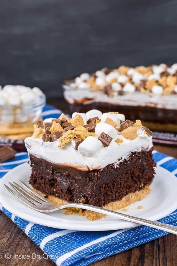 A graham cracker crust, chocolate pudding, and a marshmallow topping make this Chocolate S’mores Pudding Cake the perfect summer dessert for picnics and parties.
