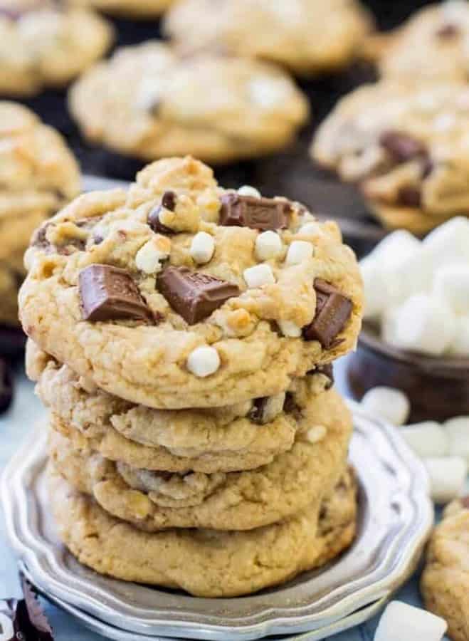 Slightly crisped, perfectly marshmallow-y, gooey and exceedingly chocolatey s’mores cookies made with a graham cracker base.  These S’mores Cookies are the perfect way to get your s’mores fix without a campfire.