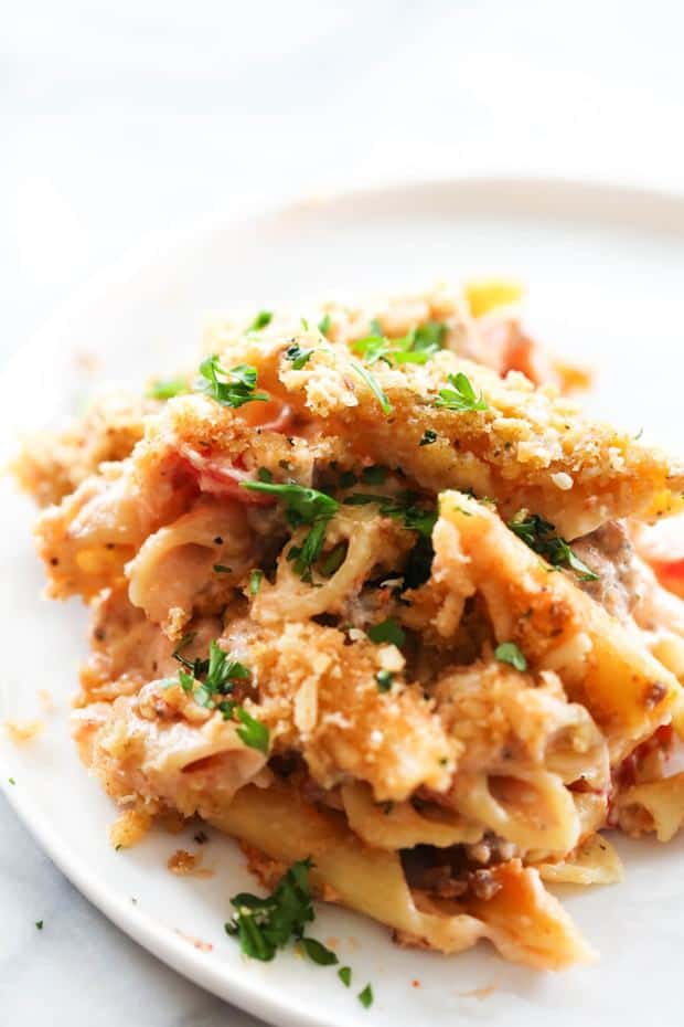 This Creamy Italian Pasta Casserole is rich, flavorful and absolutely delicious! It is comprised of the most flavorful creamy Italian sauce, sausage and cheese. This is one crowd pleasing meal that is sure to become a new regular in your home!