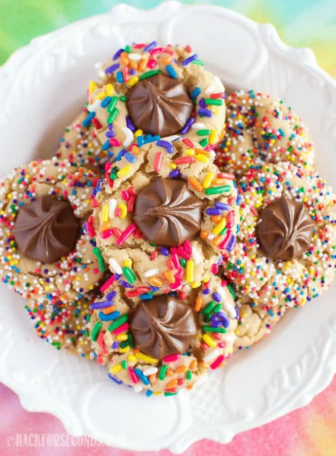 Chewy Rainbow Sprinkle Cookies are so fun and festive, with (or without) a milk chocolate center! A secret ingredient makes them completely irresistible!
