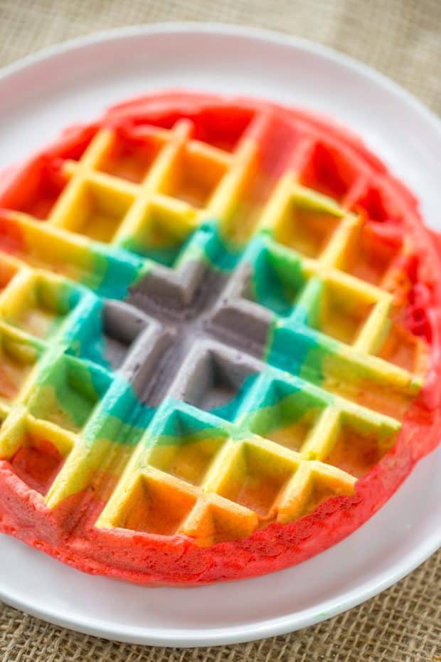 Belgian Rainbow Waffles will make your St. Patrick’s Day Breakfast a hit with homemade Belgian waffles turned into beautiful rainbows with a pot o’ gold.