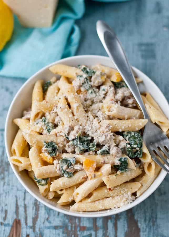 This Creamy Parmesan Sausage and Kale Pasta is a comforting meal that comes together in less than 30 minutes.