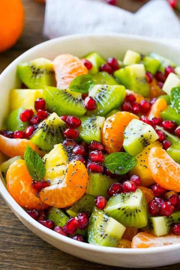 This Winter Fruit Salad Recipe is a colorful variety of fresh fruit tossed in a light honey poppy seed dressing. The perfect side dish for brunch or a holiday meal!