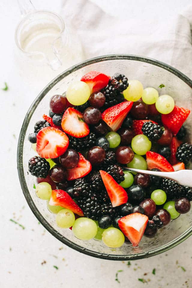 Moscato Fruit Salad – Prepared with colorful grapes and berries, this light, boozy, and delicious fresh fruit salad makes the perfect accompaniment to your summer nights!
