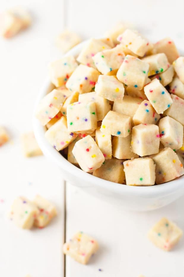 Teeny tiny shortbread bites studded with rainbow sprinkles. These Rainbow Bites are so addictive, the kids will love this!