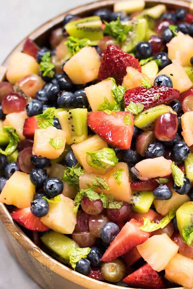 Honey Lime Mojito Fruit Salad – A quick, easy, and refreshing summer fruit salad with a tangy honey lime dressing, and the addition of mint for a splash of mojito flavor!