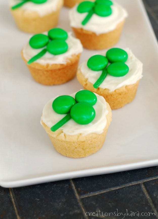 Shamrock Cookie Cups- A simple sugar cookie recipe jazzed up for St. Patrick’s Day with candy on top. Cute and tasty!