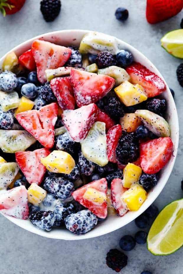 Creamy Poppy seed Fruit Salad is made with delicious mouthwatering fruit and tossed in a creamy poppy seed dressing. This will be a hit at your next potluck!