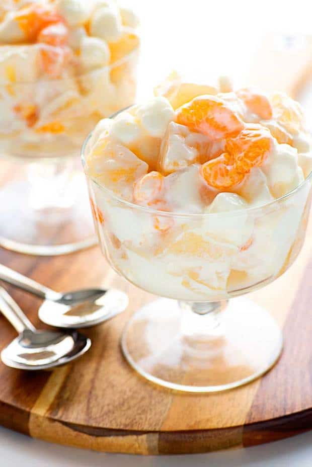 A summer-loving fruit salad with mandarin oranges, pineapple, and pears mixed with mini marshmallows and vanilla Greek yogurt.