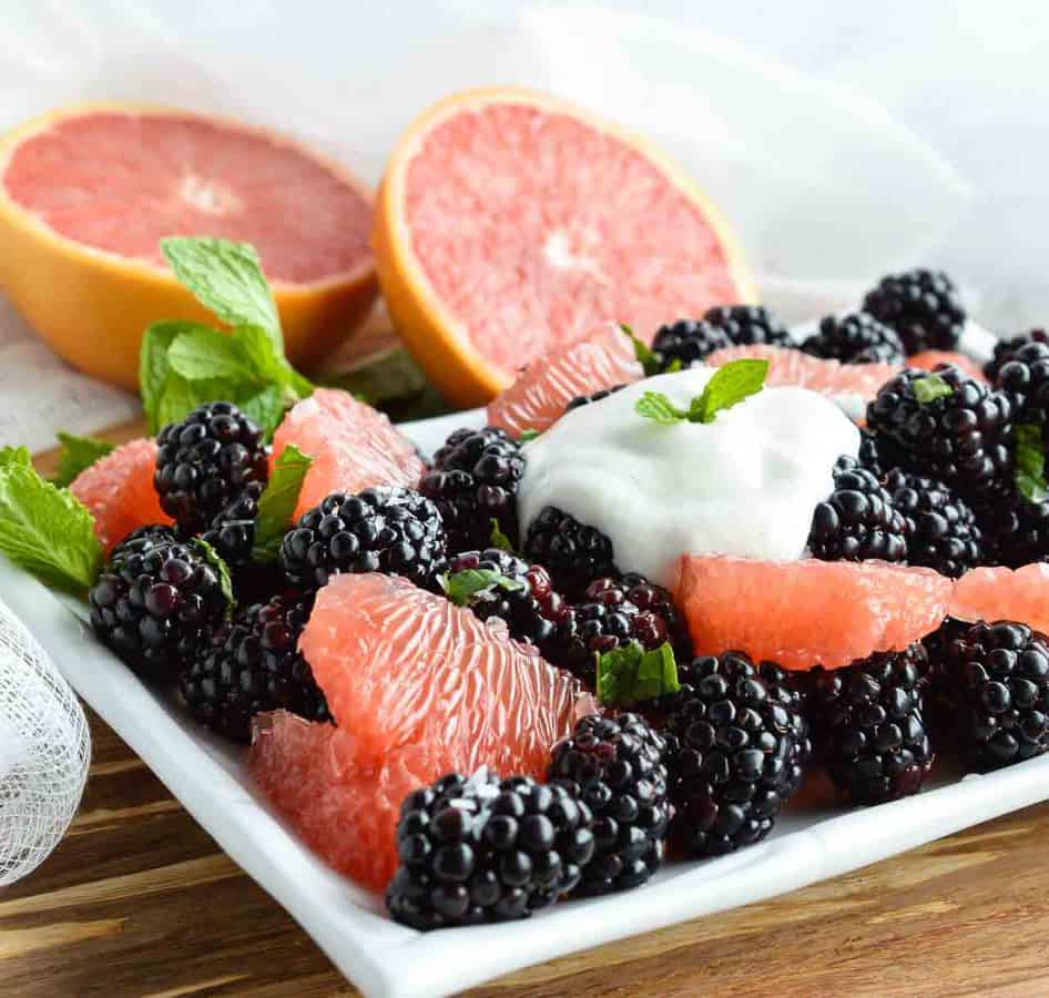 Start your day with this Easy Fresh Fruit Salad Recipe. A simple combination of sweet blackberries, tangy grapefruit, fresh mint and creamy Greek yogurt. The perfect healthy breakfast, snack or side dish!