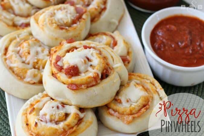 These Pizza Pinwheels from Butter with a Side of Bread are the perfect appetizer and party recipe that your friends and family will love! They are super EASY to make and will leave everyone asking for more -- so you might want to make a double batch!