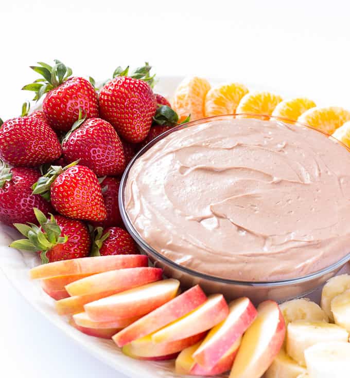 It only takes 5 minutes and a handful of ingredients to whip up this chocolate almond butter fruit dip.  The base of this dip is Greek yogurt and almond butter, making it as healthy as it is yummy.