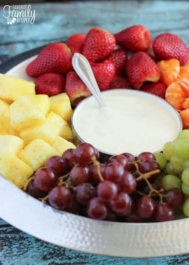 This Easy Fruit Dip has only 4 ingredients and takes just a few minutes to whip together.  It is smooth and creamy with a hint of citrus.  It complements the flavor of every kind of fruit.  I love it with apples, oranges, pineapple, strawberries, kiwi, grapes, bananas, cantaloupe, watermelon, and any other fruit that is in season.