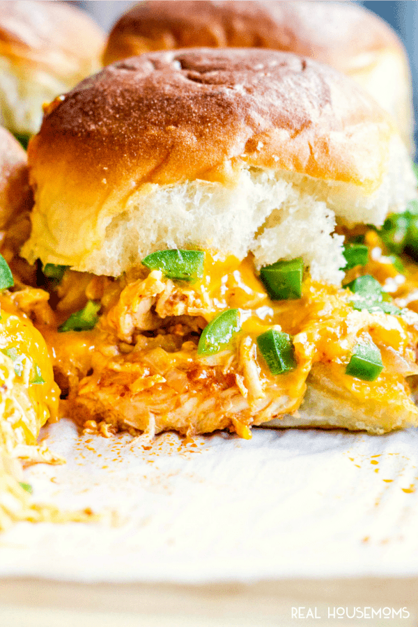 These easy Chicken Enchilada Sliders make a great game day appetizer for feeding a crowd! Loaded with Mexican food flavors, they’re sure the be a hit!