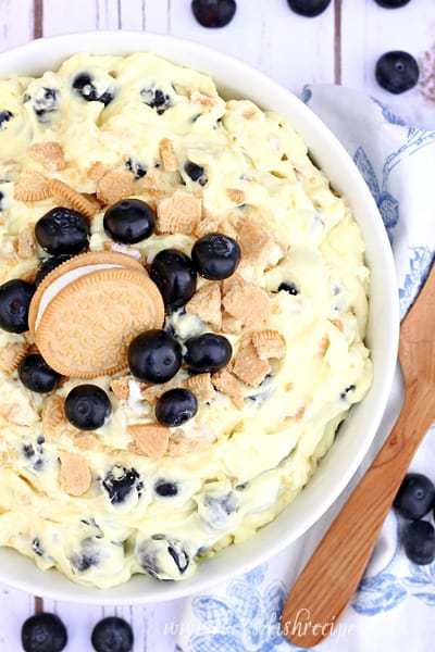 Everybody needs a good potluck salad recipe in their collection. You know, the fluffy kind made with pudding and whipped cream. And you won’t have any leftovers when you bring this Golden Lemon Blueberry Cheesecake Salad to your n