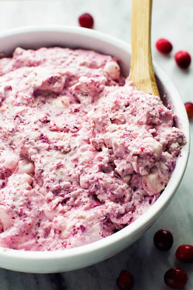 A creamy and delicious cheesecake fluff salad with cranberries and walnuts.  It is so easy to make and a must make for the holidays!