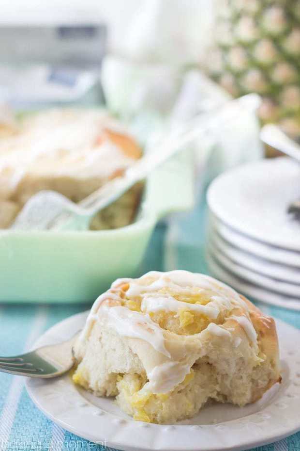 Sweet, tender yeast rolls swirled with a luscious pineapple cream cheese filling, topped with a tangy cream cheese drizzle.  This tropical twist on the classic cinnamon roll is sure to be a hit at your next brunch!