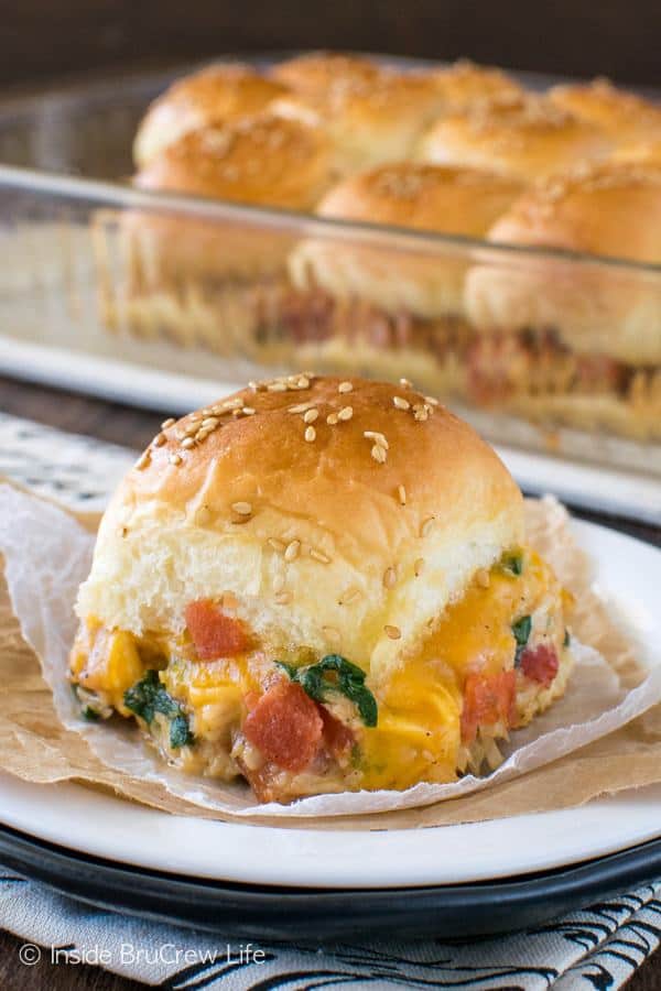 Need a quick and easy meal idea for busy nights? Add these Cheesy Chicken Sliders to your menu and watch everyone devour the loaded dinner rolls when you place them on the table.