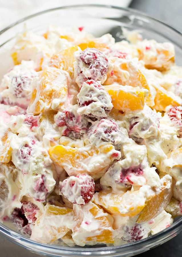 aspberry Peach Cheesecake Salad – An amazingly refreshing fruit salad that’s rich and creamy with cheesecake filling!  Perfect for summer with the addition of raspberries and peaches!