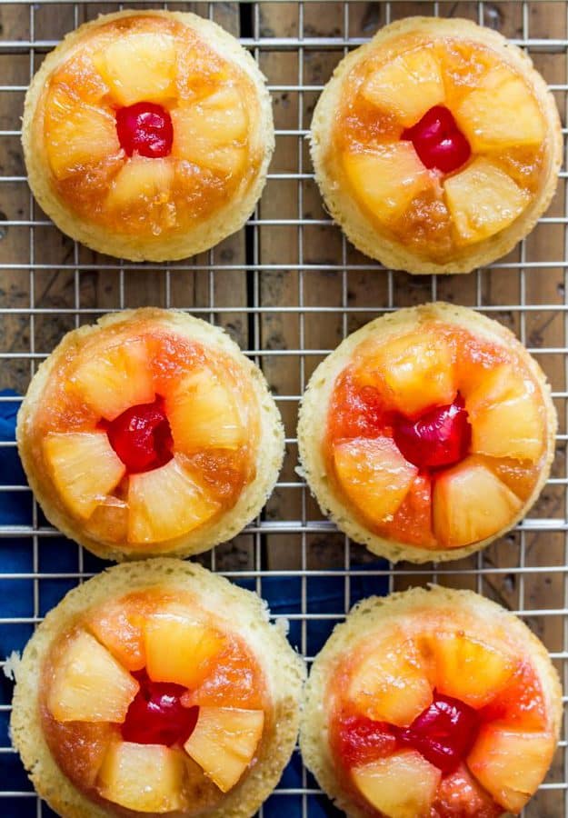 Sweet and simple pineapple upside down-cupcakes made entirely from scratch (don’t worry, they’re easy!).  With fluffy vanilla cupcake bases topped off with caramelized pineapple and maraschino cherries, these are a great new way to enjoy a classic recipe!