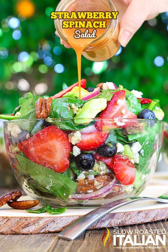 Best Ever Strawberry Spinach Salad will rock your world! This simple recipe is a celebration of summers bounty in the most spectacular salad you will ever eat. Fresh crisp spinach salad is taken to another level with bursts of sweetness from fresh summer fruit and buttery avocado. It is tossed in a sweet and tangy vinaigrette and topped with crunchy nuts and creamy cheese.