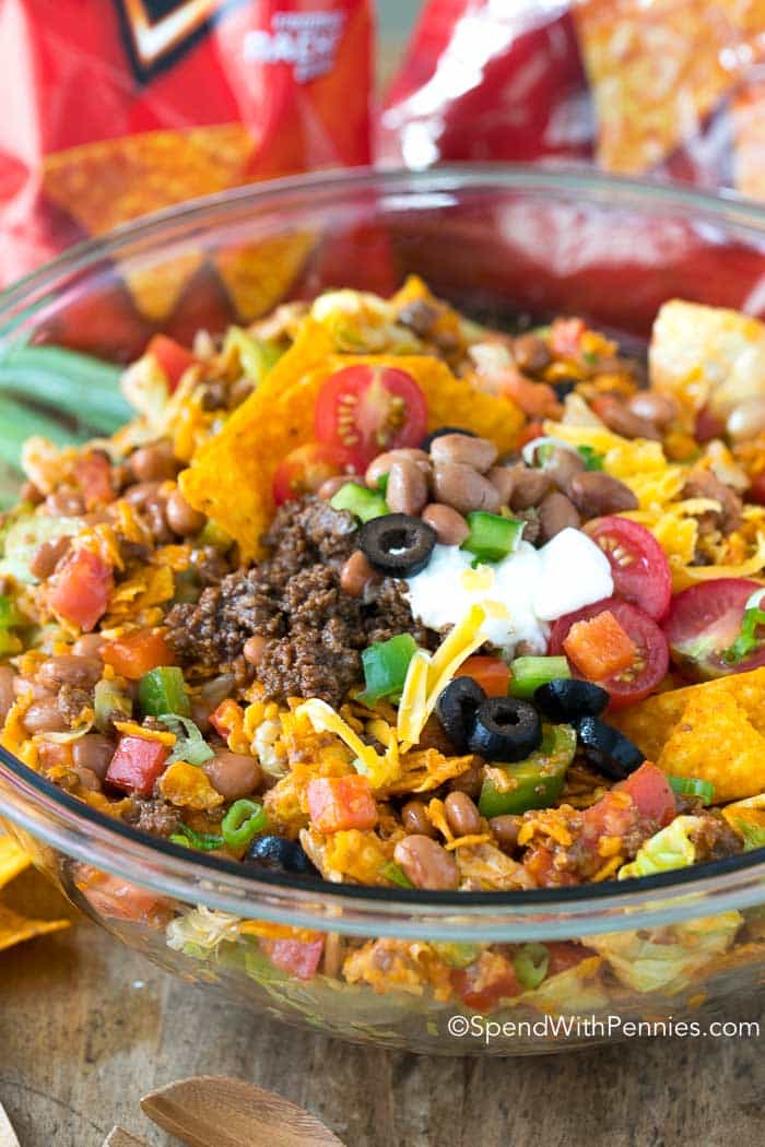 Seasoned ground beef, fresh lettuce, pinto beans, veggies and of course Doritos all sauced up with a zingy dressing make this an exciting change to your daily menu!