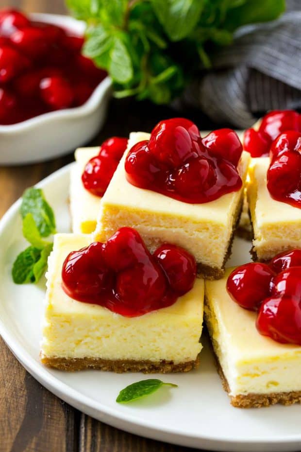 Cherry Cheesecake Bars are the perfect make-ahead dessert for any occasion! Creamy cheesecake sits atop a homemade graham cracker crust, and is finished off with a generous helping of cherries.