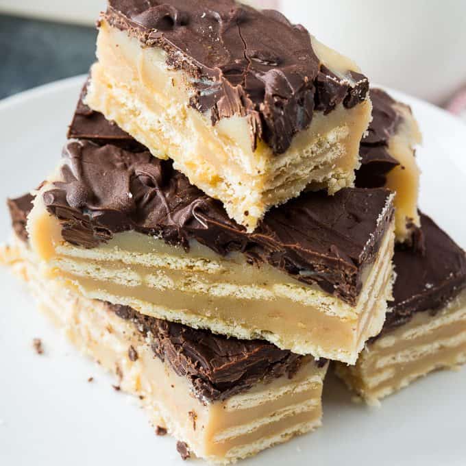 Chocolate Caramel Cracker Candy is a layered candy made with club crackers and a sugary caramel sauce with chocolate on top. This easy no-bake dessert tastes like a twix bar. Whether it is for a bake sale or a holiday treat, this sweet and salty candy is hard to resist.