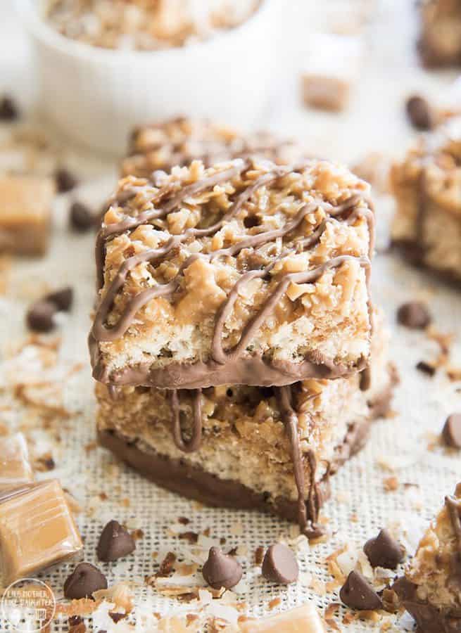 These Samoa Rice Krispie Treats take traditional rice krispies to the nest level. They're topped with a toasted coconut and caramel mixture, and drizzled and dipped with chocolate, just like your favorite girl scout cookie!