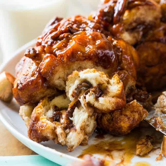 Chocolate-Caramel Monkey Bread has a gooey chocolate caramel candy melted in every bite. It’s loaded with both chocolate and caramel plus a few pecans for some crunch. You won’t find a sweeter, more dessert-like Monkey Bread than this one.