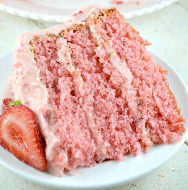 This Triple Decker Strawberry Cake is an absolute showstopper. Its super moist, rich and really sweet!
