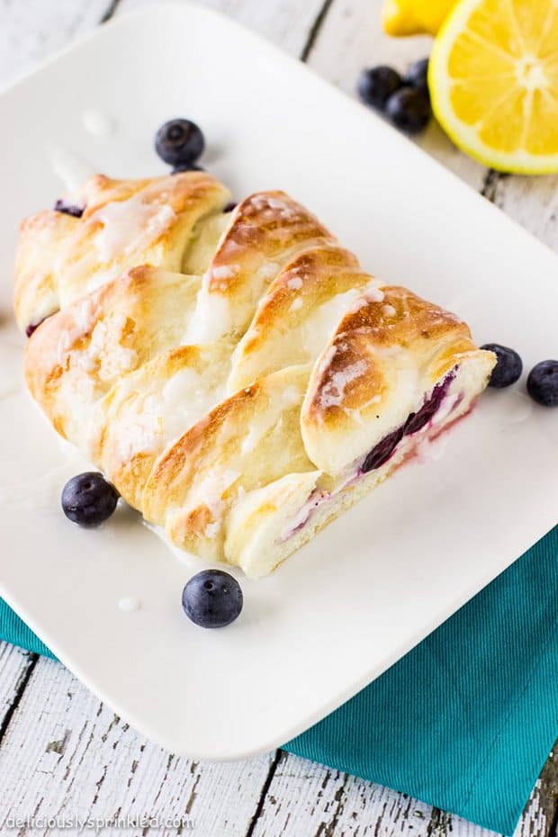 Blueberry Lemon Cream Cheese Bread filled with a zesty lemon cream cheese mixture and bursting with fresh blueberries. Drizzled with a simple lemon glaze.