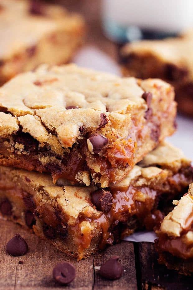 Perfectly chewy chocolate chip cookie bars with an ooey gooey peanut butter caramel center.  These will be one of the best treats that you make!