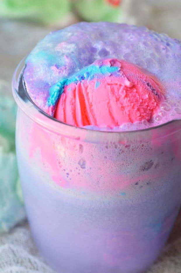 Get the party started with this Cotton Candy Unicorn Party Punch and Unicorn Ice Cream Cake! The punch recipe is made simply with 2 ingredients and the ice cream cake takes just minutes to decorate. The kids will love this fun and colorful drink!