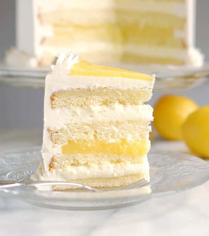 Luscious lemon mousse cake might be the perfect layer cake. Lemon cake with Limoncello syrup, zesty lemon curd and creamy lemon mousse.