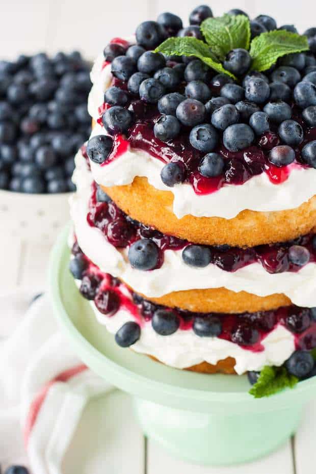 This Blueberry Shortcake is the perfectly light dessert for summer. Layers of vanilla cake, whipped cream, blue berry sauce, and fresh blueberries.